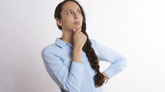 A woman thinking about how to find a side hustle ideas